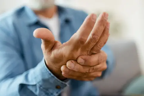 photo of older man holding hand